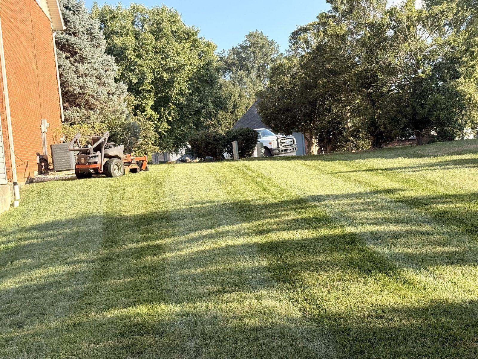 Lawn care — zero-turn mower on site