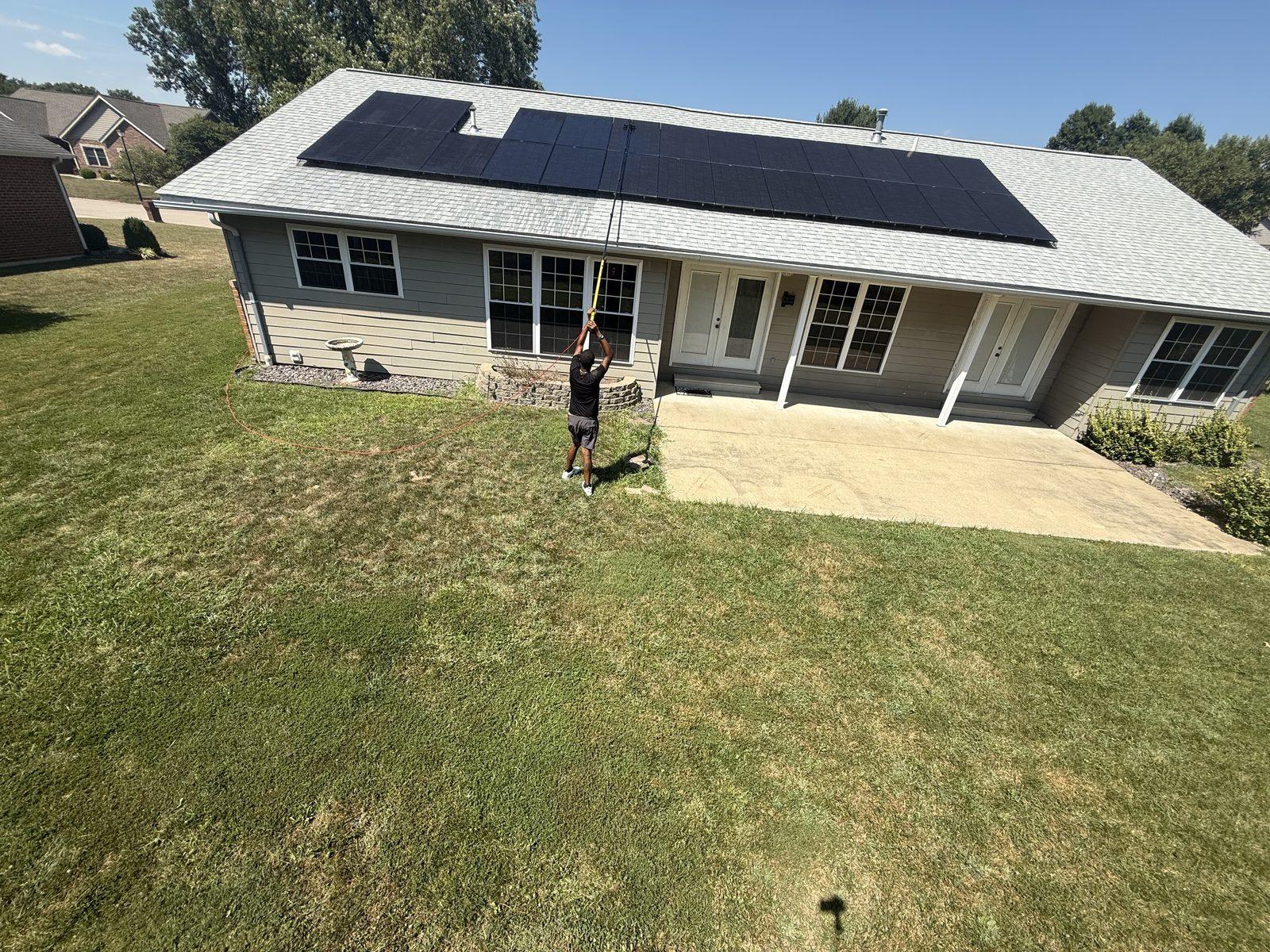 Solar panel cleaning — close work on roof panels