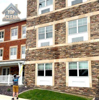 Window cleaning — commercial multi-story reach from ground