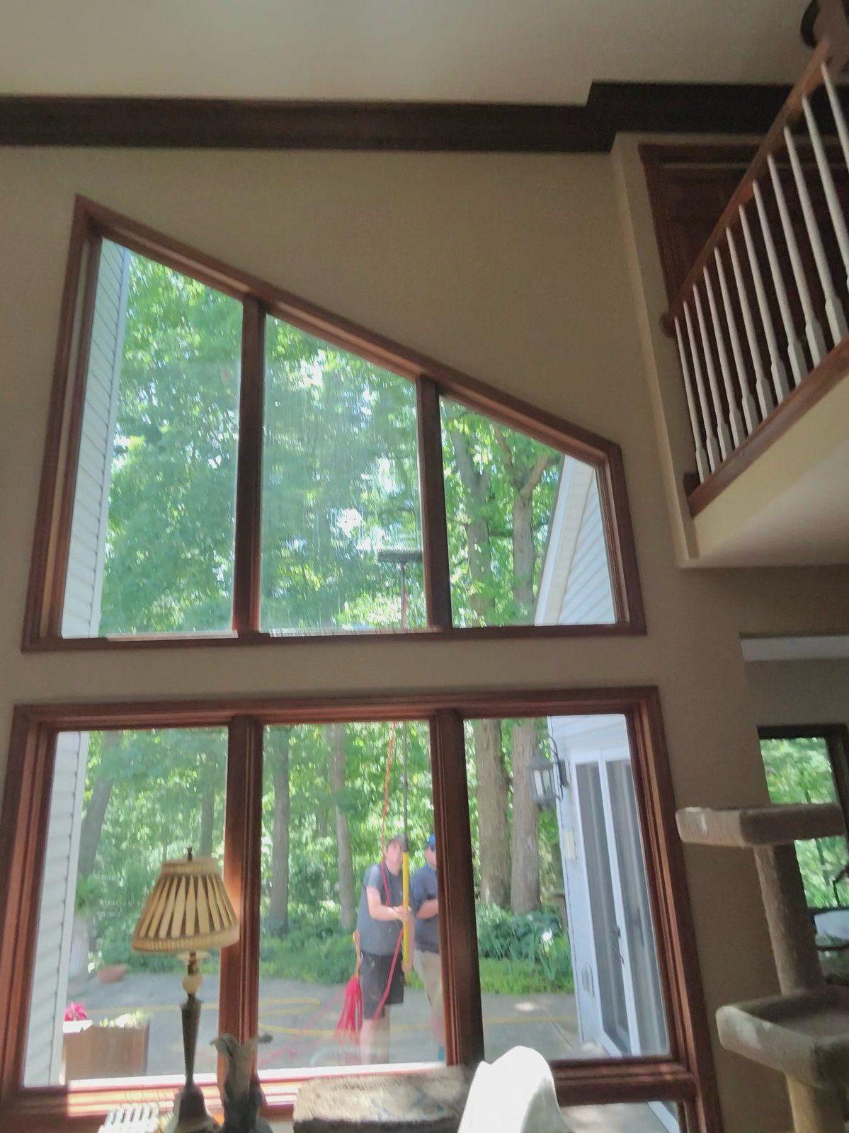 Window cleaning — interior view of pole cleaning high glass